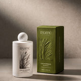 Calm Breeze Shampoo fles naast de olijfgroene verpakkingsdoos